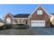 Brick house with attached garage and landscaping at 625 Aya Cir, Loganville, GA 30052