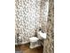 Elegant powder room with pedestal sink and toile wallpaper at 1473 Mahogany Chse, Acworth, GA 30101