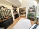 Wet bar with dark cabinetry, wine rack and access to living room at 1473 Mahogany Chse, Acworth, GA 30101