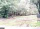 Wooded backyard with some open grassy areas at 150 Brookview Dr, Riverdale, GA 30274