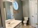 Bathroom with toilet, sink, and shower/tub combo at 150 Brookview Dr, Riverdale, GA 30274