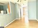 Open living room with light wood flooring and neutral walls at 150 Brookview Dr, Riverdale, GA 30274
