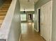 Light and bright entryway with stairs leading upstairs and view to living room at 150 Brookview Dr, Riverdale, GA 30274