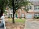 Brick townhouse with a one-car garage at 150 Brookview Dr, Riverdale, GA 30274