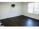 Bedroom with dark laminate flooring and a window at 12101 Fairington Ridge Cir, Lithonia, GA 30038