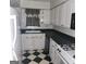 White kitchen with black countertops at 3290 Abbeywood Dr, Decatur, GA 30034