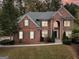 Two-story brick home with landscaping at 145 Bridgestone Cv, Fayetteville, GA 30215