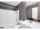 Clean bathroom with white vanity, tub and mirror at 1120 Strath Clyde Way, Mcdonough, GA 30253