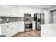 Modern kitchen with stainless steel appliances and white cabinets at 1120 Strath Clyde Way, Mcdonough, GA 30253