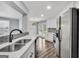 Modern kitchen featuring stainless steel appliances and white cabinetry at 1120 Strath Clyde Way, Mcdonough, GA 30253