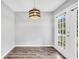 Dining area with hardwood floors and French doors leading outside at 1120 Strath Clyde Way, Mcdonough, GA 30253