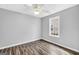 Bright bedroom with wood-look floors and ceiling fan at 1120 Strath Clyde Way, Mcdonough, GA 30253