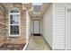 Front entry with stonework and a walkway at 1120 Strath Clyde Way, Mcdonough, GA 30253