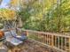 Back deck with lounge chairs and umbrella, overlooking the trees at 976 Arbor Way, Mcdonough, GA 30253