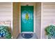Green front door entrance with potted plants at 312 Brittany Ct, Duluth, GA 30096