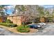 Brick building exterior with ample parking and landscaping at 312 Brittany Ct, Duluth, GA 30096
