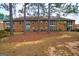Brick building exterior with trees and landscaping in front at 312 Brittany Ct, Duluth, GA 30096