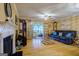 Living room with hardwood floors, fireplace, and access to a sunroom at 312 Brittany Ct, Duluth, GA 30096