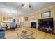 Living room with hardwood floors, fireplace, and dining area at 312 Brittany Ct, Duluth, GA 30096