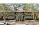Two-story building exterior with multiple units, landscaping, and fountain at 312 Brittany Ct, Duluth, GA 30096