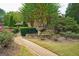 Brick pathway, fountain, lush landscaping, and a gazebo at 312 Brittany Ct, Duluth, GA 30096