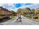 Gated entrance to community with landscaping and paved driveway at 312 Brittany Ct, Duluth, GA 30096