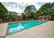 Inviting community pool with brick coping and pool house at 312 Brittany Ct, Duluth, GA 30096