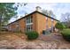 Rear view of two-story brick building with patio areas at 312 Brittany Ct, Duluth, GA 30096