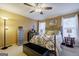 Spacious bedroom with iron bed frame and ceiling fan at 312 Brittany Ct, Duluth, GA 30096