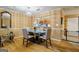 Bright dining room with hardwood floors and a view into the kitchen at 312 Brittany Ct, Duluth, GA 30096