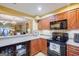 Kitchen with breakfast bar and view into living room at 312 Brittany Ct, Duluth, GA 30096