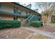 Two-story building exterior with stairs and green landscaping at 312 Brittany Ct, Duluth, GA 30096