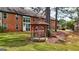 Wooden gazebo with benches, located in a grassy area at 312 Brittany Ct, Duluth, GA 30096