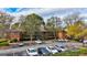 Two-story building, ample parking, and surrounding trees at 312 Brittany Ct, Duluth, GA 30096