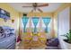 Bright sunroom with yellow chairs and a small table at 312 Brittany Ct, Duluth, GA 30096