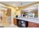 Kitchen with breakfast bar and view into living room at 312 Brittany Ct, Duluth, GA 30096