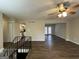 Open living room with vinyl flooring and access to kitchen and back patio at 6410 Buckhurst Trl, Atlanta, GA 30349