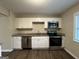 Modern kitchen with stainless steel appliances and granite countertops at 6410 Buckhurst Trl, Atlanta, GA 30349