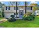 Two-story home with attached garage and landscaping at 6410 Buckhurst Trl, Atlanta, GA 30349