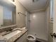 Clean bathroom with shower/tub combo, granite vanity, and mirror at 6410 Buckhurst Trl, Atlanta, GA 30349