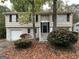 Two-story home with attached garage and landscaping at 6410 Buckhurst Trl, Atlanta, GA 30349