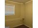 Unfinished basement area with neutral wall and carpet flooring at 6410 Buckhurst Trl, Atlanta, GA 30349
