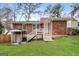 Brick ranch house with a landscaped yard and steps leading to the entrance at 1262 Lorenzo Sw Dr, Atlanta, GA 30310