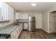Modern kitchen with white cabinets, granite countertops, and stainless steel appliances at 1262 Lorenzo Sw Dr, Atlanta, GA 30310