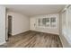 Living room with hardwood floors and large window at 1262 Lorenzo Sw Dr, Atlanta, GA 30310
