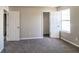 Spacious bedroom with neutral walls, plush carpet, and ample closet space at 2124 Hairston Creek Pkwy, Decatur, GA 30035
