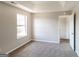 Bedroom with grey carpeting and a window at 2124 Hairston Creek Pkwy, Decatur, GA 30035