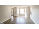 Spacious living room with bay windows and light-colored wood flooring at 2124 Hairston Creek Pkwy, Decatur, GA 30035