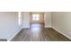 Open living room with hardwood floors and access to dining area at 2124 Hairston Creek Pkwy, Decatur, GA 30035