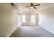 Spacious bedroom with ceiling fan and grey carpeting at 2124 Hairston Creek Pkwy, Decatur, GA 30035